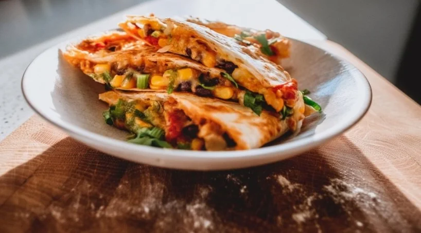 Delicious vegetarian quesadilla filled with colorful vegetables and melted cheese