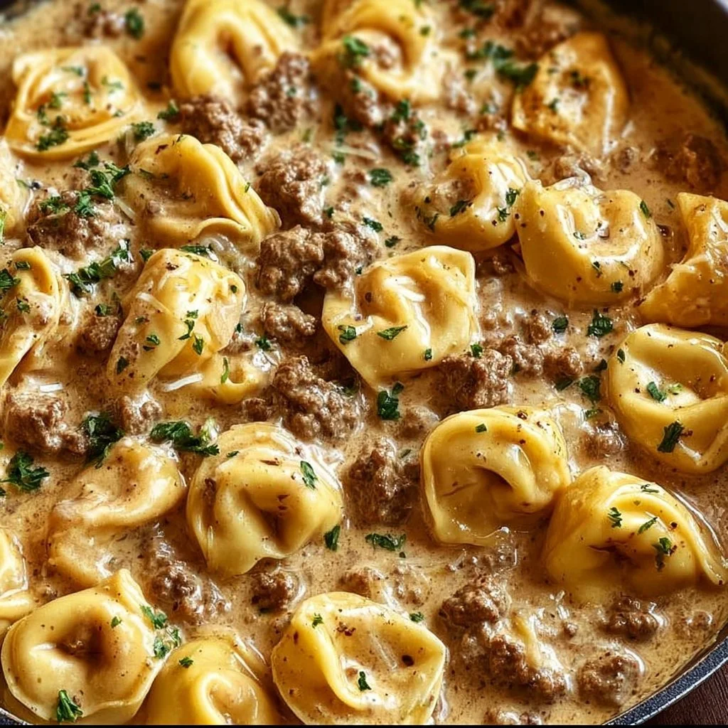 Creamy beef stroganoff with tortellini served on a plate