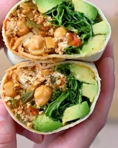 Vegetarian tofu burritos filled with beans, veggies, and spices